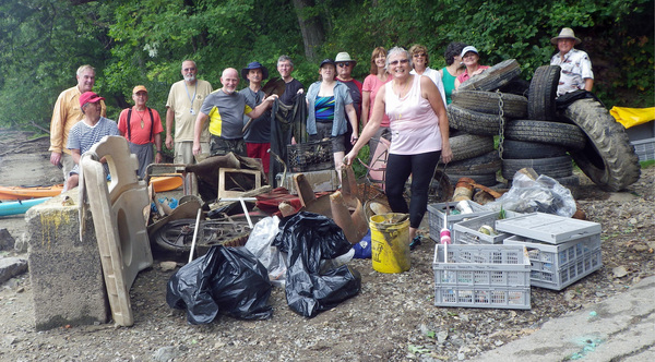 Above, group shot with the pile of trash we picked up. I am third from left in back row. Below, still life of the trash.