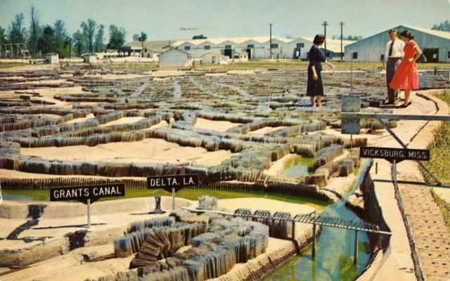 This postcard from the model’s tourist era shows the view looking upriver at Vicksburg, MS (see sign on right). The smaller body of water is the Yazoo River, which meets the Mississippi at Vicksburg. The Mississippi takes a left at the mouth of the Yazoo and continues upstream.