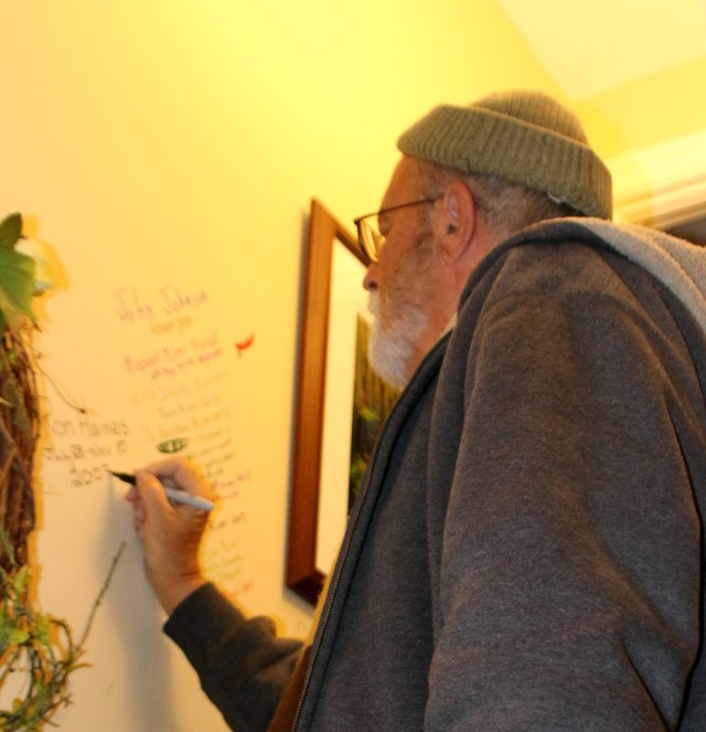 Ron Haines signing wall at Dale Sanders house on 10/31/19.  Photo by Sue Haines